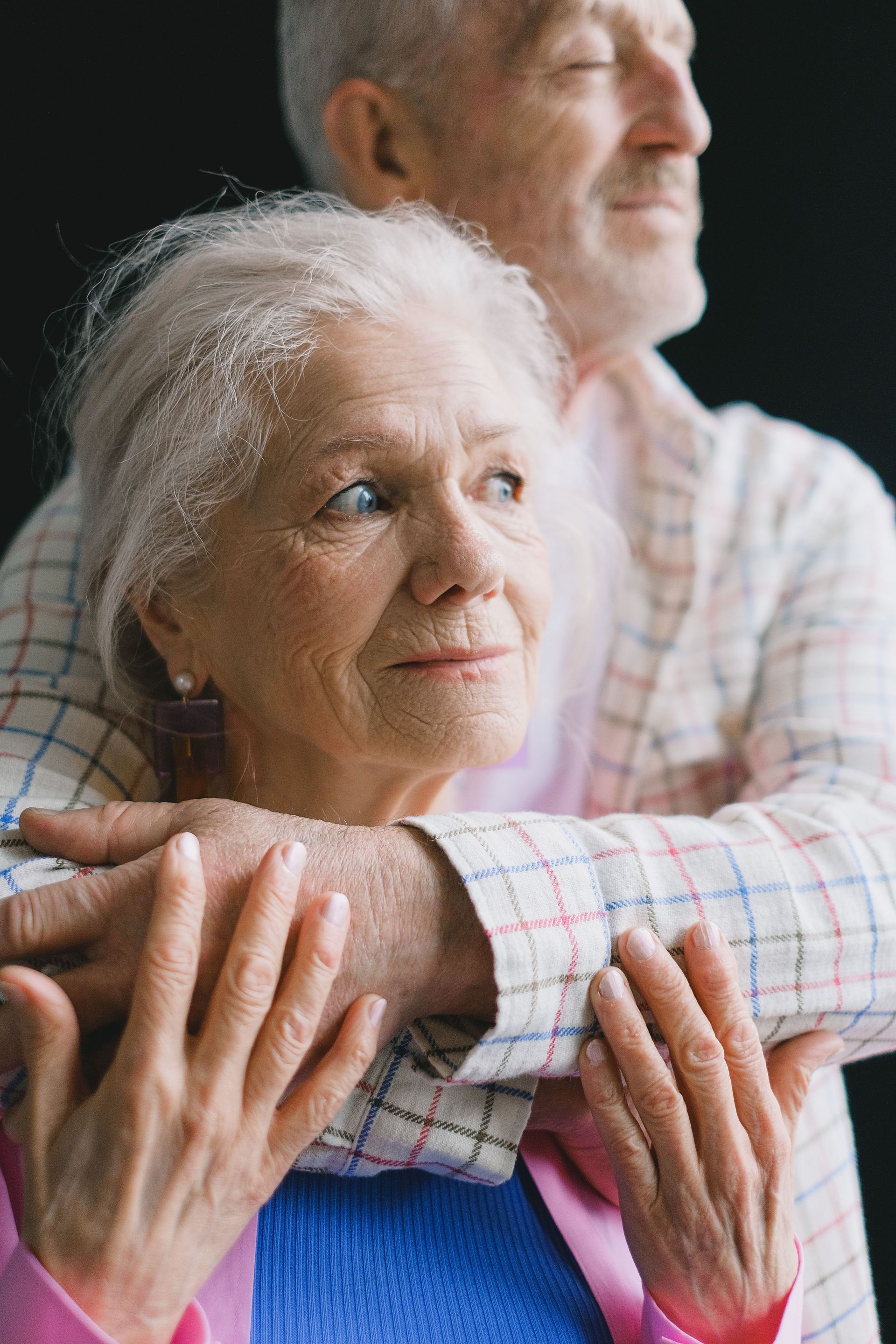 An elderly couple sharing a tender moment, symbolizing love and companionship.